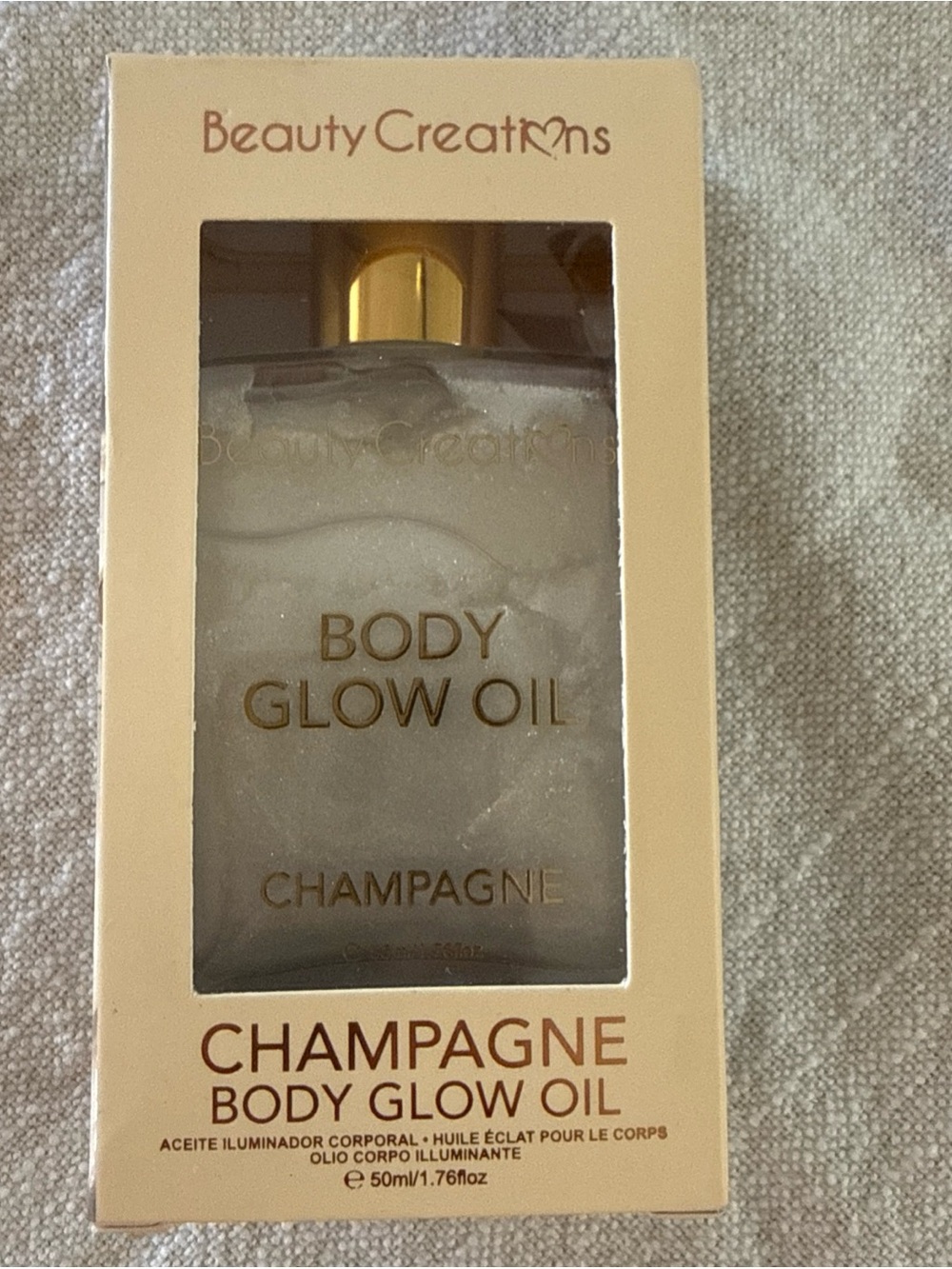 Beauty Creations Champagne Body Glow Oil - Shimmering Gold Bottle